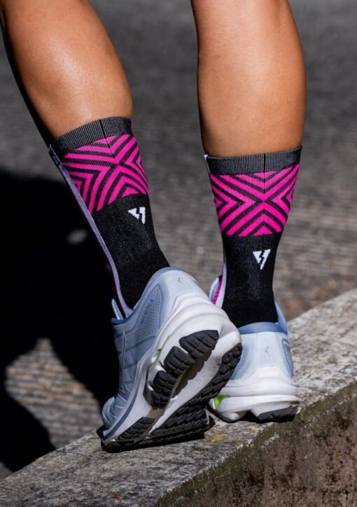 Vibrant running socks and sneakers on a jogging trail, depicting fitness and style.