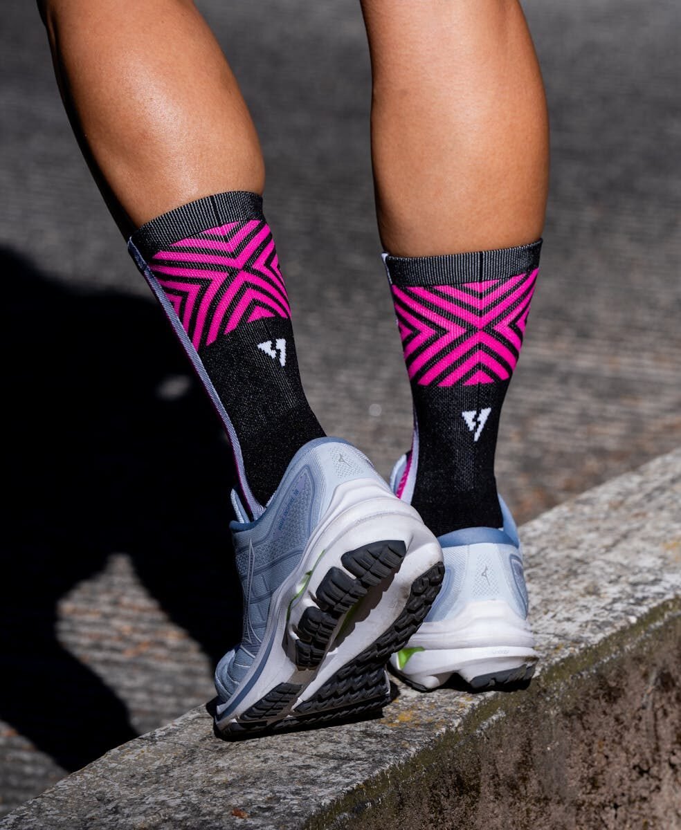 Vibrant running socks and sneakers on a jogging trail, depicting fitness and style.