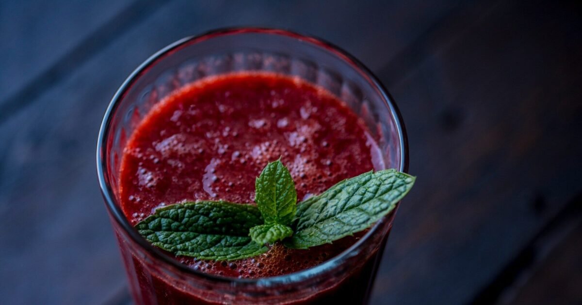 red drink in clear glass