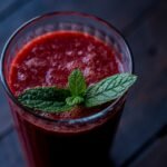 red drink in clear glass