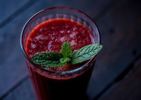 red drink in clear glass