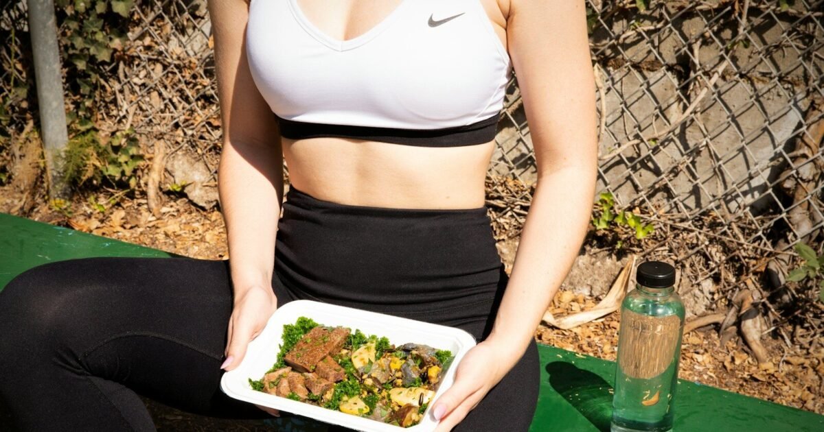woman wearing white and black Nike sports bra