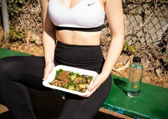 woman wearing white and black Nike sports bra