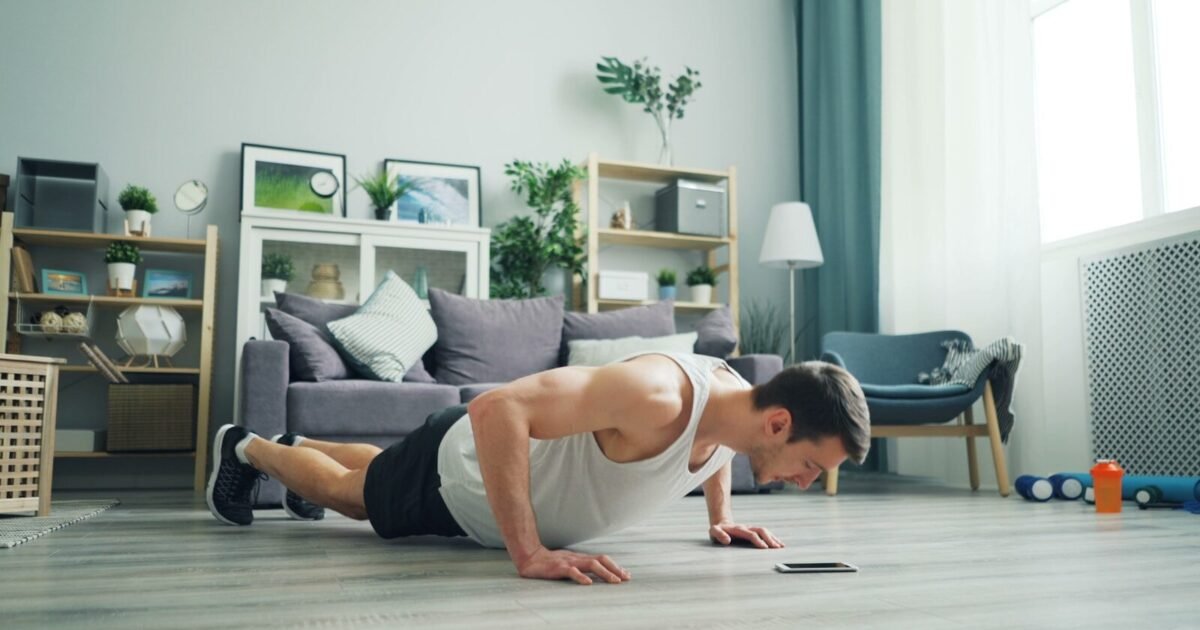 a man is doing push ups on the floor