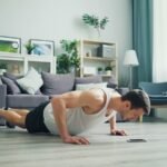 a man is doing push ups on the floor