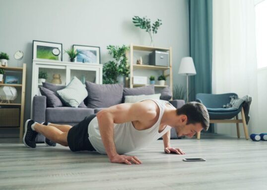 a man is doing push ups on the floor