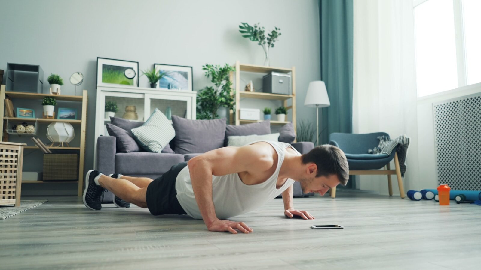 a man is doing push ups on the floor