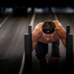 A man is doing push ups on a bench